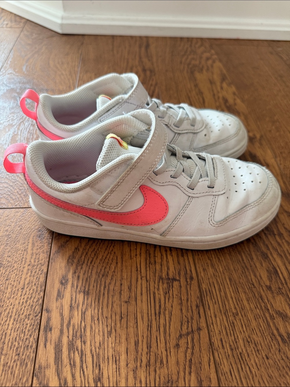 Nike Kids White Sneakers with Pink Swoosh and Heel Tab - size 2Y